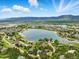 Panoramic aerial view of the community showcasing the beautiful lake and mountain views at 18590 Lower Lake Rd, Monument, CO 80132