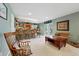 Basement bar area with comfortable seating and backyard access at 18590 Lower Lake Rd, Monument, CO 80132