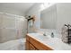 Well-lit bathroom features a shower and updated vanity at 18590 Lower Lake Rd, Monument, CO 80132