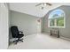 Bright room with vaulted ceiling and large arch window at 18590 Lower Lake Rd, Monument, CO 80132