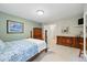 Charming bedroom with four poster bed, light green walls, and carpeted floors at 18590 Lower Lake Rd, Monument, CO 80132