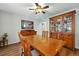 Traditional dining room featuring wood furniture, hardwood floors, and a ceiling fan at 18590 Lower Lake Rd, Monument, CO 80132
