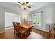 Sunlit dining room featuring hardwood floors and a large window with beautiful backyard view at 18590 Lower Lake Rd, Monument, CO 80132