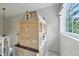 A beautifully crafted dollhouse sits near a window with exterior views at 18590 Lower Lake Rd, Monument, CO 80132