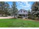 Lovely home with a well-manicured lawn and mature trees, creating a welcoming curb appeal at 18590 Lower Lake Rd, Monument, CO 80132