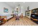 Inviting living room featuring hardwood floors, vaulted ceilings, and a cozy fireplace at 18590 Lower Lake Rd, Monument, CO 80132