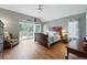 Serene main bedroom featuring french doors, hardwood floors, and a comfortable seating area at 18590 Lower Lake Rd, Monument, CO 80132