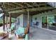 Inviting outdoor patio space with comfortable seating, perfect for relaxing and enjoying the surrounding nature at 18590 Lower Lake Rd, Monument, CO 80132