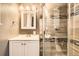 Stylish bathroom featuring modern fixtures, glass enclosed shower, a sleek vanity, and tiled accents at 2885 E Midway Blvd # 1542, Denver, CO 80234