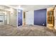 Comfortable bedroom with neutral carpeting, ensuite bath and walk-in closet with plenty of natural light at 2885 E Midway Blvd # 1542, Denver, CO 80234