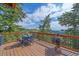 Relaxing deck space with outdoor dining and scenic views of the surrounding mountain landscape at 10390 Hondah Dr, Littleton, CO 80127