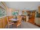 Bright dining area with wood accents, natural light, and kitchen access, perfect for Gathering meals and entertaining at 10390 Hondah Dr, Littleton, CO 80127
