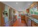 Well-equipped kitchen with stainless steel appliances, wooden cabinets, and an open layout for easy access to the dining area at 10390 Hondah Dr, Littleton, CO 80127