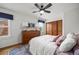 Cozy bedroom featuring wood floors, closet, and comfortable furnishings at 9551 W 38Th Ave, Wheat Ridge, CO 80033