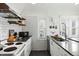 A kitchen with stainless appliances, a brick chimney and open shelving at 9551 W 38Th Ave, Wheat Ridge, CO 80033