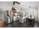 Bright kitchen with stainless steel appliances, island, and exposed brick chimney at 9551 W 38Th Ave, Wheat Ridge, CO 80033