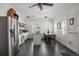 Bright kitchen featuring stainless steel fridge, an island and a dining area at 9551 W 38Th Ave, Wheat Ridge, CO 80033