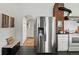 Kitchen featuring stainless fridge and white cabinets at 9551 W 38Th Ave, Wheat Ridge, CO 80033