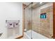 Bright bathroom features tiled shower, modern fixtures, and convenient towel rack at 405 Village Rd # 405, Breckenridge, CO 80424