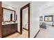 Updated bathroom adjacent to bedroom features modern vanity and neutral color palette at 405 Village Rd # 405, Breckenridge, CO 80424