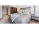 Spacious bedroom features a comfortable bed, ample lighting, and neutral decor at 405 Village Rd # 405, Breckenridge, CO 80424