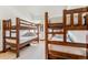 Bright bedroom with wooden bunk beds and carpeted floor at 405 Village Rd # 405, Breckenridge, CO 80424