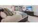Comfortable bedroom with a large bed, ensuite bathroom, and serene outdoor views at 405 Village Rd # 405, Breckenridge, CO 80424