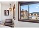 Inviting bedroom with picturesque views, chair, and natural light at 405 Village Rd # 405, Breckenridge, CO 80424
