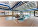 Indoor pool area with a waterslide and hot tub offering year-round aquatic enjoyment at 405 Village Rd # 405, Breckenridge, CO 80424