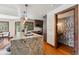 Bright kitchen with a marble counter island, modern appliances, and wooden cabinets at 405 Village Rd # 405, Breckenridge, CO 80424