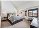 Inviting main bedroom features a king bed, and a view of the mountains with great natural light at 405 Village Rd # 405, Breckenridge, CO 80424