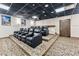 Luxurious home theater room featuring plush seating and a large projector screen at 405 Village Rd # 405, Breckenridge, CO 80424