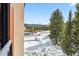 View of the mountain in the distance surrounded by trees and snow from the condo at 405 Village Rd # 405, Breckenridge, CO 80424