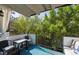 Relaxing balcony with comfortable seating and views of lush green trees at 1265 Elizabeth St # 305, Denver, CO 80206