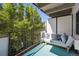 Charming balcony offers a serene outdoor space with comfortable seating and lush greenery at 1265 Elizabeth St # 305, Denver, CO 80206