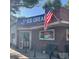 Charming ice cream shop exterior with the American flag flying, promising a delightful treat and inviting atmosphere at 1265 Elizabeth St # 305, Denver, CO 80206