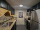 Well-lit kitchen featuring stainless steel appliances, granite countertops, and modern fixtures at 1265 Elizabeth St # 305, Denver, CO 80206