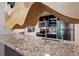 Open-concept kitchen featuring granite countertops and stainless steel appliances, perfect for entertaining at 1265 Elizabeth St # 305, Denver, CO 80206