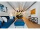 Open-concept living room and dining area with modern decor and hardwood floors at 1265 Elizabeth St # 305, Denver, CO 80206