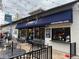 Restaurant exterior showcasing outdoor seating with umbrellas, featuring a vibrant storefront and inviting ambiance for diners at 1265 Elizabeth St # 305, Denver, CO 80206