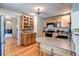 Bright kitchen featuring wooden cabinets, granite countertops, stainless steel appliances, and hardwood floors at 29090 Golf Way, Evergreen, CO 80439