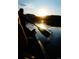 Serene lake view at sunset, capturing the tranquil beauty of Evergreen, Colorado from a canoe at 29090 Golf Way, Evergreen, CO 80439