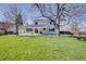 Beautiful backyard featuring a spacious lawn, mature shade trees, and space for gatherings and play at 6708 S Niagara Ct, Centennial, CO 80112