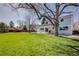Lush backyard features a well-maintained lawn, patio, covered patio, and ample space for recreation at 6708 S Niagara Ct, Centennial, CO 80112
