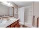 This bathroom has a vanity, mirror, shower and tub combo, and decor at 6708 S Niagara Ct, Centennial, CO 80112