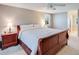 This bedroom features a king-size sleigh bed, ceiling fan, and neutral tones at 6708 S Niagara Ct, Centennial, CO 80112