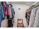 Spacious walk-in closet with ample hanging storage and unique chair at 6708 S Niagara Ct, Centennial, CO 80112