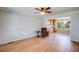 Open-concept living room with hardwood floors connecting to the kitchen, offering a spacious layout at 6708 S Niagara Ct, Centennial, CO 80112