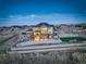 Stunning aerial view of the home showcasing the spacious backyard, landscaping, and surrounding neighborhood at 8727 Hunters Hill Ln, Littleton, CO 80125