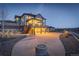 Backyard patio area with a built-in fire pit, ideal for cozy evenings spent outdoors and enjoying mountain views at 8727 Hunters Hill Ln, Littleton, CO 80125
